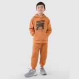 Chlapčenské teplákové nohavice typu jogger - oranžové · záber 3